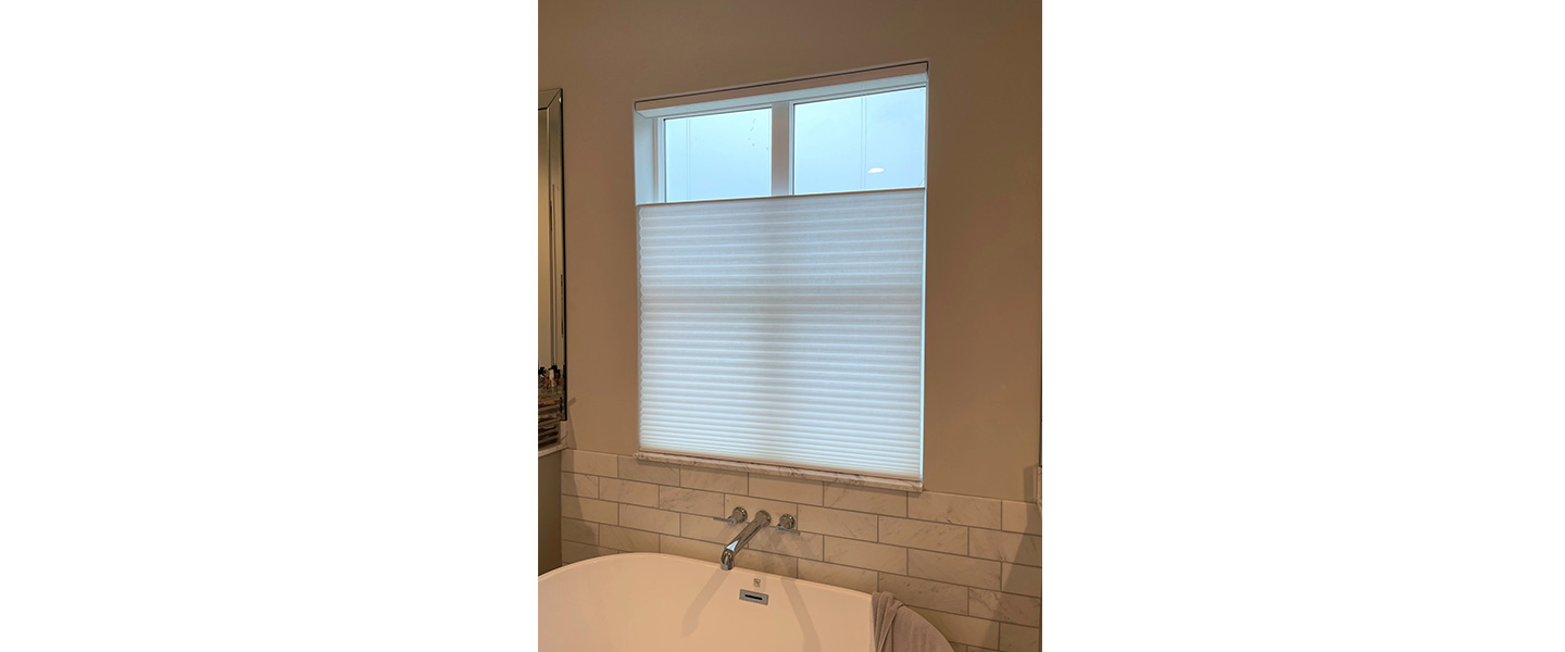 bath tub near window