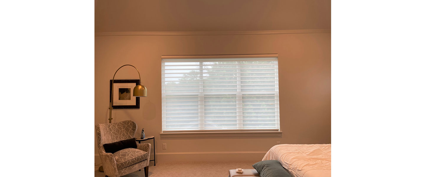 Window covered with white curtain